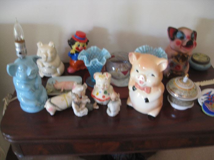 Collection of pig banks, light, figurines and a celluloid clown bank