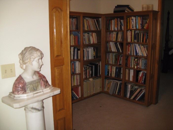 Many books and Mignon Marble bust and base