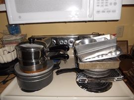 Lots of pots and pans and other cookware items
