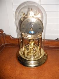 Domed brass 400 day anniversary clock by Elgin