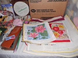 Some of the needlework canvas selections (top one worked--rest of stack unworked)