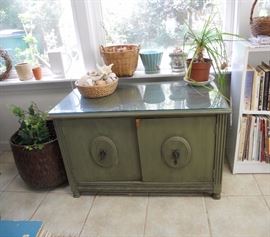 Antique record cabinet that has been antiqued green       Has glass protective top