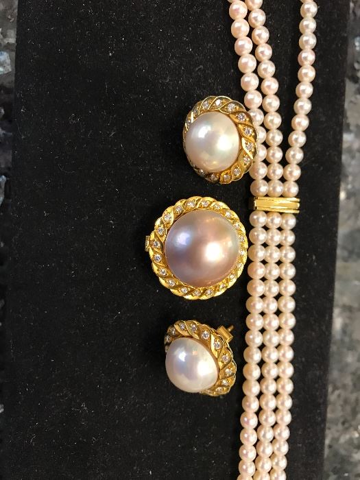 Mujoharat Al-Sharo, 3-strand cultured pearl necklace in gold,  and diamonds.  Matching earrings and pendant
