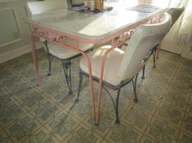 Metal base table with marble top-sic wrought iron chairs