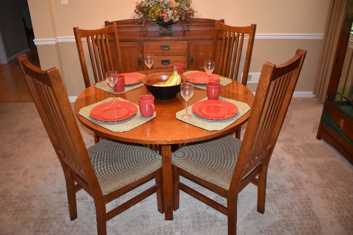 Mission style oak round dining table with 4 oak chairs in the Stickley motif 