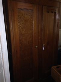 This antique oak armoire is great for storage.