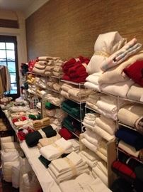 Large selection of towel, sheets, placemats, pillows, and other linens