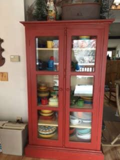 Red Curio Cabinet with modern Fiesta Ware