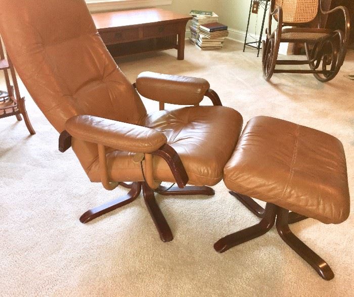 Side view of stressless-style leather chair and ottoman, from Ikea