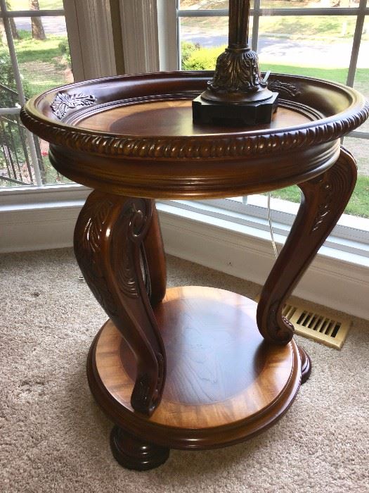 Eye-catching round two-tier table, matches coffee table and end tables in formal living area