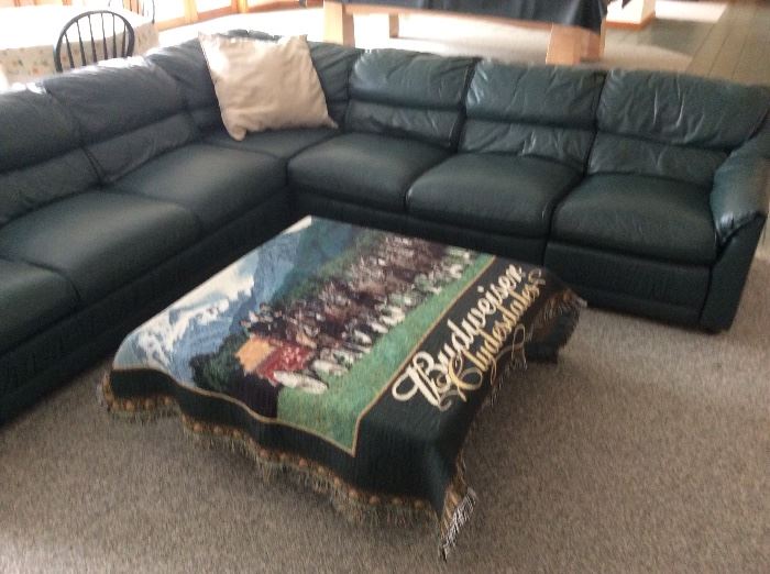 Leather Sectional Sofa, far end section is recliner. Also has matching ottoman.