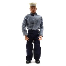 Vintage 1970s GI Joe "Action Sailor" Original with Box and Inserts: A 1960s original Hasbro GI Joe Action Sailor item #7600 with original box and paper inserts. The figure includes a blonde painted head figure, his uniform, hat, dog tag, and boots.