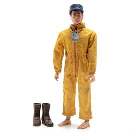 Rare 1964 Original GI Joe Action Pilot with Triple TM Box: A rare original 1964 Hasbro GI Joe Action Pilot 11.5" action figure item #7800 with goldenrod snap waist flight suit. This soldier features the second issue snap waist flight suit in goldenrod and first issue rubber boots with a metal dog tag, a navy fatigue hat, and the ‘triple trademarked’™ original box. This pilot also features faint handpainted eyeliner or ‘eyeshadow’ eyes and smaller feet. The box is marked 7/64 with the ‘triple trademarked’™ original box. The box is marked 7/64 with trademark™ notations under GI Joe, under Action Soldier, and under the phrase “America’s movable fighting man” on the box front.