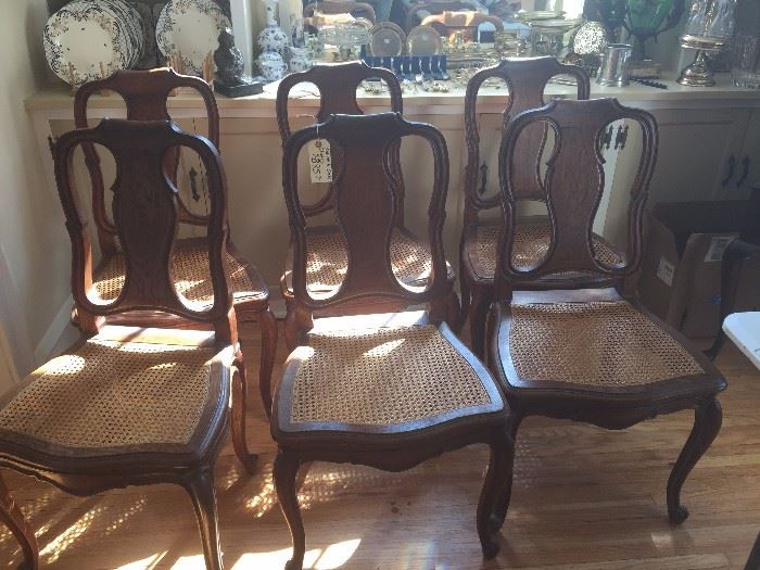 Set of 6 matched oak chairs with canned seats.