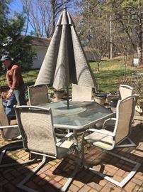 Lg patio set with six chairs, unbrella and stand.  Needs a good cleaning, but in great condition.