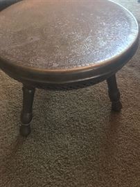 Another view of the vintage brass foot warming stool