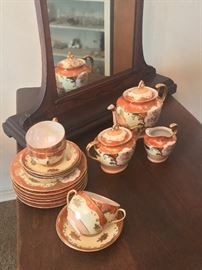 Hand painted early 20th century Japanese tea set. Gorgeous orange color 