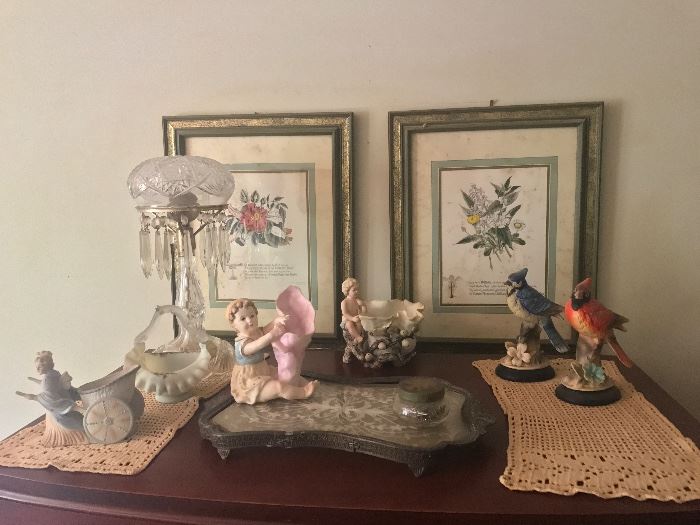 Cut glass lamp. Old bird statues. Floral prints. Victorian era bisque and porcelain statues 