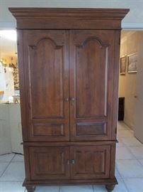 Very Nice Armoire.  Was originally a clothing armoire -  so not too deep -  and still has the wood hanging pole.  Owner cut a hole in back to accommodate video equipment.  Can be reattached.