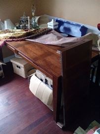 2 years old Solid wood never used been covered Dinning Table 70"wide 18"leaf 41deep and 30"tall $125.00           