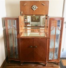 "Everything" Bar...It opens to a lighted and mirrored interior, has compartments for bottles, glasses, and bar utensils, and a preparation counter