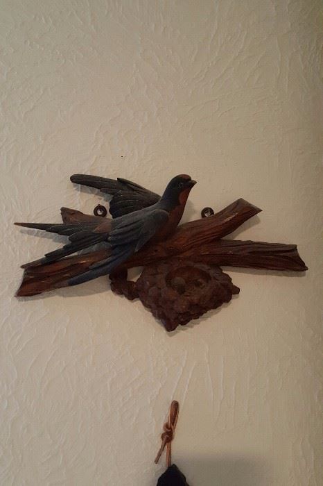 carved wood bird plaque