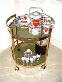 Brass and glass tea cart, tea sets