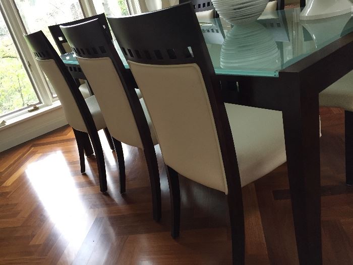 Contemporary 9 Piece Dining Room Set-  Seats are covered in faux leather and wood is in the color of espresso.                               