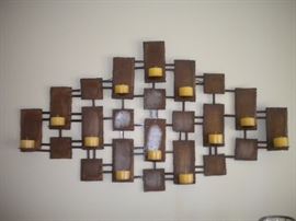 Metal wall art with candles