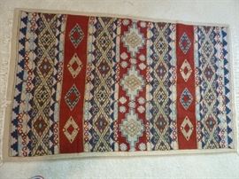100% wool handmade in Nepal...great quality! Wood work as wall hanging as well!