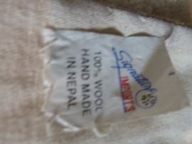 100% wool handmade in Nepal...great quality! Wood work as wall hanging as well!