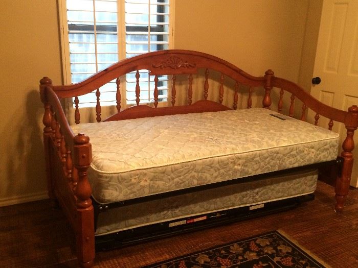 Very nice wood day bed with pop up trundle. Includes mattresses.