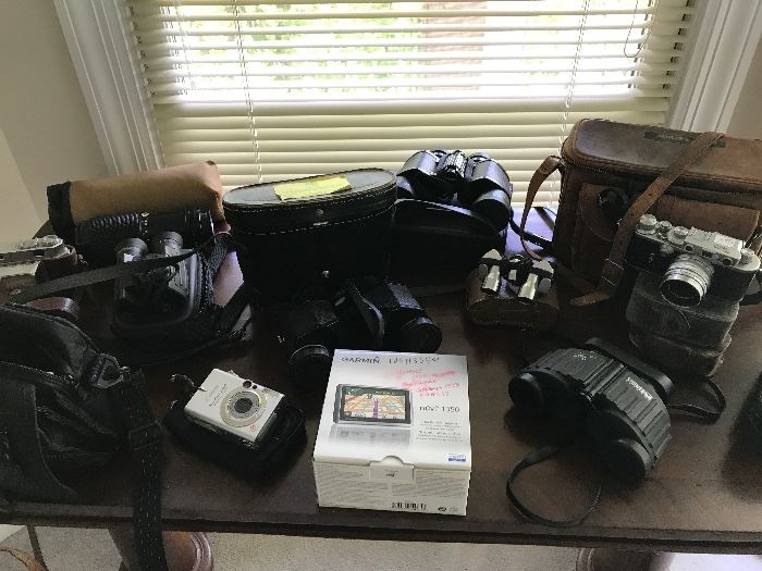 Collection of binoculars and caneras