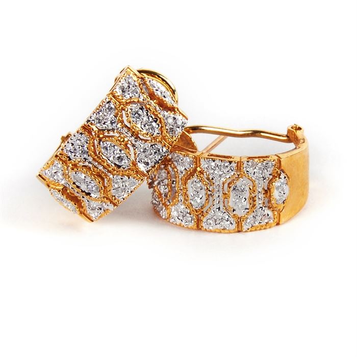 18K Yellow Gold Diamond Earrings: A pair of 18K yellow gold diamond earrings.