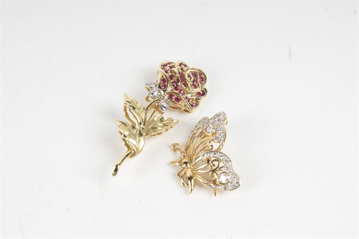 Pair of 14K Yellow Gold Diamond and Ruby Pins: A pair of 14K yellow gold 0.03 ctw diamond and ruby rose pin and 0.13 ctw diamond butterfly pin.