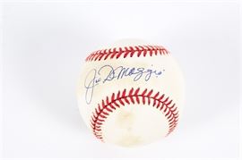 Joe Dimaggio Signed Baseball: A Joe Dimaggio signed baseball. It features an official Rawlings ball signed by New York Yankees outfielder “Joltin’ Joe” Dimaggio (1914-1999) in blue ink. He was a three-time MVP winner and an All-Star in each of his 13 seasons of play.