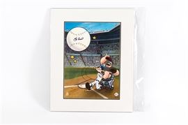 Yogi Berra Signed "Homerun Popeye" New York Yankees Offset Lithograph: A Yogi Berra signed Homerun Popeye New York Yankees offset lithograph. It depicts Popeye the sailor wearing a Yankees uniform and hitting a ball, which has been hand signed by Berra. Bluto the catcher lifts his mask and watches in amazement as the ball sails into the air. The piece is stamped with an official King Features seal and an official MLB logo, as well as hand numbered “H.C. 1/50”. It comes in a protective plastic sleeve with an Art Toon certificate of authenticity.