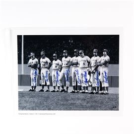 "The Big Red Machine" Fuji Crystal Photograph Signed by Pete Rose, Johnny Bench, Ken Griffey, and more: A “Great Eight” signed Fuji crystal archival photograph titled The Big Red Machine. It depicts Pete Rose, Ken Griffey, Joe Morgan, Tony Perez, George Foster, Johnny Bench, Cesar Geronimo, and David Concepcion, all with their respective autographs signed in blue marker. The image is marked with an International Photo Archives logo. Comes in a plastic sleeve with a Classic Moments certificate of authenticity, as well as a collage of each player signing the photograph.