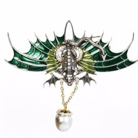 Large Sterling Silver 14K Gold and Diamond Encrusted Brooch or Pendant: A unique Joseph Holland original design. The piece is defined by elongated spiked green enamel wings to the silver body and diamond-lined spine while holding a yellow gold and diamond enhanced large natural black Tahitian pearl.