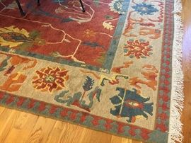 Persian Heriz rug with  brick colored center and ivory and blue border 	9’ x 12’, 20th c