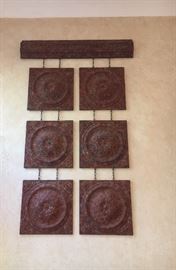 Large metal wall sculpture in rust- tone hanging 	squares , decorative