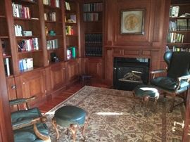 ‘Minton Spidell’ Leather and wood armchairs w/
ottomans, pair

Iranian Persian rug, 5’ x 7’, in beige and greens, 20th c		