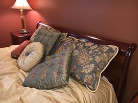 Cherry sleigh bed in dark finish. Make in France. 