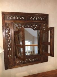Carved Indonesian mirror with shutters