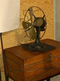 Lorts wooden chest on legs.
Westinghouse Antique fan atop