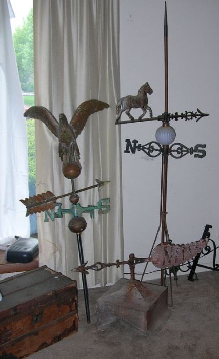 Eagle weathervane, cupula, horse weathervane and lightning rod.