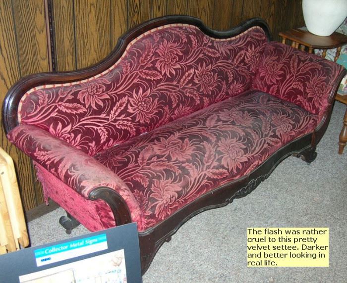 Antique velvet settee. Looks much prettier in person.