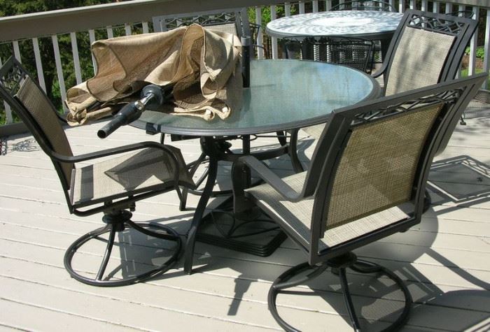 Patio table with 4 chairs and matching umbrella