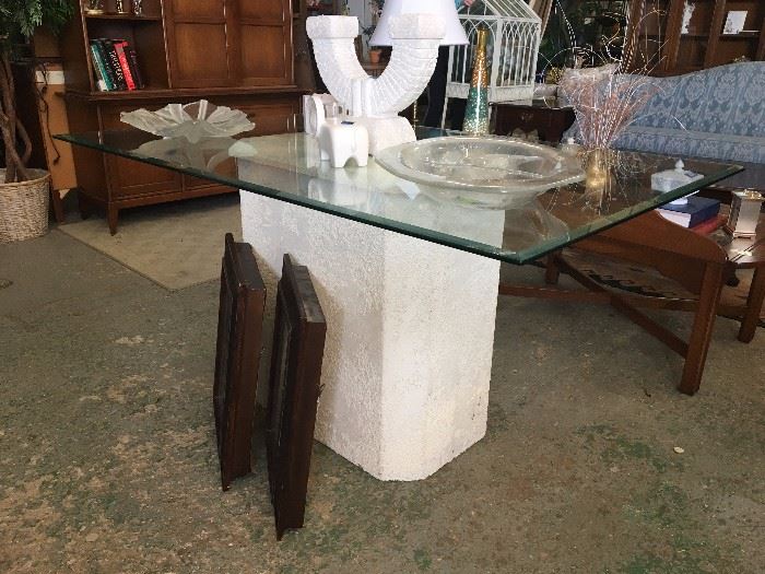 Glass dining table with white pedestal