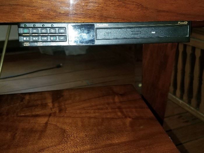CD player unit on piano